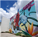 Picture of side view of Mural. Vibrant colors. Picture of flamingo, panther, and manatee with flower